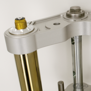 Caliper brckt clr Ohlins 11.8" l/h 00-up (DE)